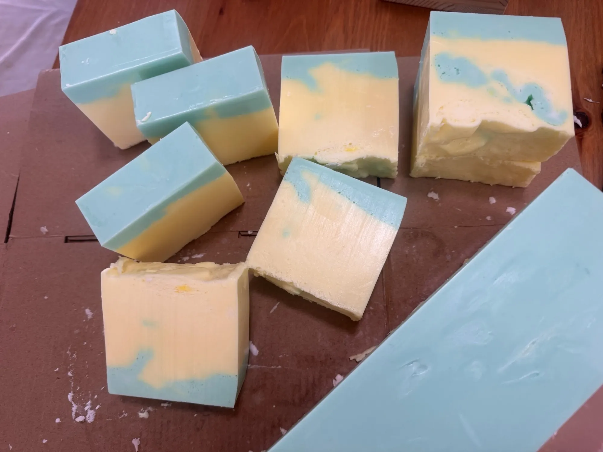 Freshly cut bars of handmade soap in pale blue and yellow